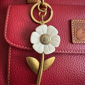 White and brass flower bag charm with rhinestones